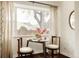 Dining area features a small round table, two chairs, and a bright window view at 4420 W 27Th Ave, Denver, CO 80212