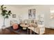 Bright living room showcasing a plush sofa, contemporary artwork, and elegant lighting fixtures at 4420 W 27Th Ave, Denver, CO 80212