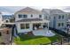 A charming backyard with a covered patio, lawn, and seating, perfect for outdoor relaxation and entertaining at 8939 Bellsong Cir, Littleton, CO 80125