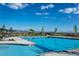 Beautiful community pool area with a sparkling pool and a bright sunny sky above on a clear day at 8939 Bellsong Cir, Littleton, CO 80125