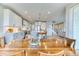 Modern kitchen with gray and white cabinets, stainless steel appliances, and a large island with seating at 8939 Bellsong Cir, Littleton, CO 80125