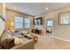 Cozy living room with comfortable seating and a large-screen television at 8939 Bellsong Cir, Littleton, CO 80125