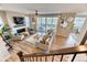 Inviting living room with modern fireplace, ceiling fan, and lots of natural light from the sliding glass doors at 8939 Bellsong Cir, Littleton, CO 80125