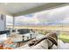 Inviting covered patio with comfortable seating and scenic outdoor views, perfect for relaxation at 8939 Bellsong Cir, Littleton, CO 80125