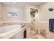 Bright bathroom showcases a standalone shower with glass doors and a soaking tub with tile surround at 3109 Newport Cir, Castle Rock, CO 80104