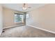 The bedroom offers lots of natural light with a nice view from the large window, and neutral carpeting at 3109 Newport Cir, Castle Rock, CO 80104