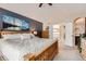 Bedroom with wooden bed and large windows overlooking a bright view at 3109 Newport Cir, Castle Rock, CO 80104
