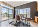 Cozy breakfast nook featuring large windows, a dining table set, and sliding door access at 3109 Newport Cir, Castle Rock, CO 80104