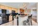 Kitchen featuring granite countertops, black appliances, tile floors and a breakfast bar with seating at 3109 Newport Cir, Castle Rock, CO 80104