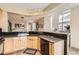 Kitchen with wooden cabinets, black appliances and countertops, and recessed lighting at 3109 Newport Cir, Castle Rock, CO 80104