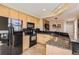 Spacious kitchen featuring granite countertops, wood cabinetry, and stainless steel appliances at 3109 Newport Cir, Castle Rock, CO 80104