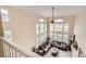 High-ceilinged living room boasts lots of windows overlooking lush golf course at 3109 Newport Cir, Castle Rock, CO 80104