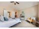 Bright main bedroom with neutral walls, vaulted ceiling and access to an ensuite bathroom at 3109 Newport Cir, Castle Rock, CO 80104
