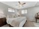 Cozy bedroom with plush carpeting, neutral walls and a ceiling fan with plenty of natural light at 6719 Quay St, Arvada, CO 80003