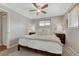 Relaxing bedroom with a ceiling fan, natural light, and neutral color palette at 6719 Quay St, Arvada, CO 80003