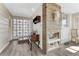 Hallway with unique tile design, decorative shelving, and natural light, creating a welcoming atmosphere at 6719 Quay St, Arvada, CO 80003