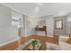 Hardwood floors in living room space with view into the kitchen at 6719 Quay St, Arvada, CO 80003