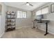 The office features neutral walls, carpeted floor, and a ceiling fan at 6719 Quay St, Arvada, CO 80003