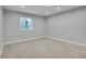 Spacious finished basement room with carpeted floor at 7301 E 82Nd Pl, Commerce City, CO 80022