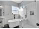 Spa-like bathroom with a freestanding tub and a large walk-in shower at 7301 E 82Nd Pl, Commerce City, CO 80022