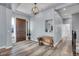 Entryway with wood door, bench, and neutral color palette at 7301 E 82Nd Pl, Commerce City, CO 80022