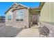 House entrance with stone and wood accents, inviting porch at 7301 E 82Nd Pl, Commerce City, CO 80022