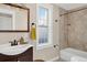 Bathroom features a vanity with sink and combination shower and tub at 4301 Zuni St, Denver, CO 80211