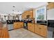 Charming kitchen with stainless steel appliances, brick accents, and ample counter space at 4301 Zuni St, Denver, CO 80211