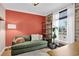 Cozy living room with a plush green sofa, stylish decor, and natural light at 4301 Zuni St, Denver, CO 80211