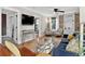 Spacious living area with exposed brick, a ceiling fan, and comfortable seating arrangement at 4301 Zuni St, Denver, CO 80211