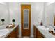 Bathroom featuring double sinks and a door to the shower at 1545 August Ln, Brighton, CO 80601