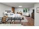Bright bedroom featuring a comfortable bed, stylish furnishings, and large window with scenic views at 1545 August Ln, Brighton, CO 80601
