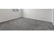 Bright bedroom featuring neutral walls, carpeting, and a sunlit window at 1545 August Ln, Brighton, CO 80601