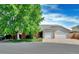 Charming home with a well-maintained front yard and two-car garage at 1545 August Ln, Brighton, CO 80601