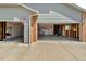 Exterior view of the multiple garages, offering lots of parking and storage space at 1545 August Ln, Brighton, CO 80601