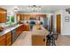 Spacious kitchen with stainless steel appliances, a breakfast bar, and ample counter space at 1545 August Ln, Brighton, CO 80601