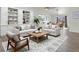 Bright living room featuring neutral furniture, built-in shelving, and ample natural light at 1545 August Ln, Brighton, CO 80601