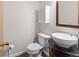 Stylish powder room with vessel sink and modern fixtures at 1545 August Ln, Brighton, CO 80601