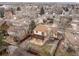 Aerial view of home highlighting the fenced backyard, stone patio and pergola at 13812 W 66Th Dr, Arvada, CO 80004