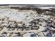 Aerial view of houses and snowy landscape at 1430 Milbury St, Castle Rock, CO 80104