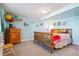 Basement bedroom with light blue walls and full-size bed at 1430 Milbury St, Castle Rock, CO 80104