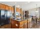 Island kitchen with granite countertops and stainless steel appliances at 1430 Milbury St, Castle Rock, CO 80104