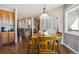 Kitchen nook with wood table and chairs, view to Gathering room at 1430 Milbury St, Castle Rock, CO 80104