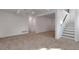 Spacious basement with neutral carpeting, bright lighting, and an open layout at 9306 Clermont Dr, Thornton, CO 80229