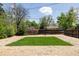 Backyard featuring a freshly mowed lawn and a gravel border at 1010 N Jasmine St, Denver, CO 80220