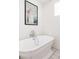 Classic bathroom with a luxurious freestanding tub, vintage-style faucet, and an eye-catching art print at 1010 N Jasmine St, Denver, CO 80220