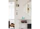 Elegant entryway with arched doorway, decorative mirror, and built-in shelving at 1010 N Jasmine St, Denver, CO 80220