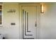 The Art Deco front door of this residence features a unique design and house numbers at 1010 N Jasmine St, Denver, CO 80220