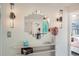 Hallway with an art-deco mirror, sleek sconces, stylish console, and decorative accents at 1010 N Jasmine St, Denver, CO 80220