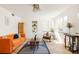 Bright living room with large windows, designer furniture, and stylish accents at 1010 N Jasmine St, Denver, CO 80220